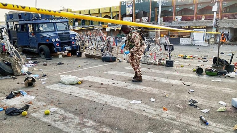 A soldier inspects the aftermath of Monday's bomb blast at a market in Maiduguri, Nigeria, Tuesday, March 17, 2026.