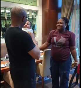 A mother, her child and a man she had long prayed to meet